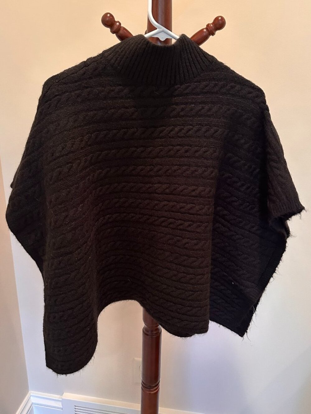 Women's black poncho sweater
